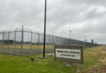 A sign and fence at the Green Hill School for juvenile offenders, in Chehalis, Washington