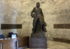 A bronze Marcus Whitman statue in the Washington state Capitol building weighs over 9,000 pounds with its stone base. (Jacquelyn Jimenez Romero/Washington State Standard)