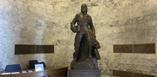 Marcus Whitman statue will soon have a new home in WA Capitol A bronze Marcus Whitman statue in the Washington state Capitol building weighs over 9,000 pounds with its stone base. (Jacquelyn Jimenez Romero/Washington State Standard)