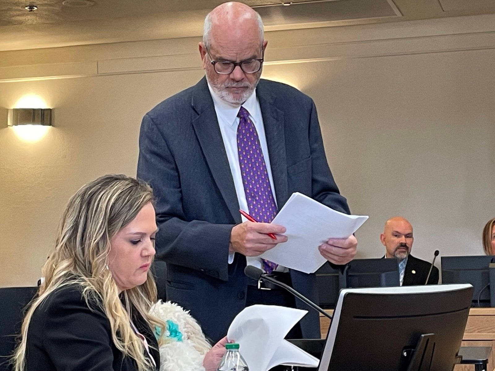 Washington state Rep. Tarra Simmons discusses documents with her attorney, Doug McKinley, before testifying at a hearing in June 2026 on allegations she violated state ethics laws. (Photo by Jerry Cornfield/Washington State Standard)
