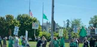 Roughly 100 state employees, most of whom are members of the Washington Federation of State Employees, lined Capitol Way in Olympia, Wash. on Aug. 31, 2026 to demand higher wages in their next two-year contract. (Photo by Aspen Ford/Washington State Standard)