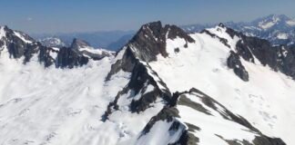 A view of glacier-clad peaks in Washington’s North Cascades. Snow in Idaho, western Montana, the Washington Cascades and Snake River Basin melted two to five weeks earlier than normal in 2026, and in parts of the Oregon Cascades, mountain snowpack melted two months earlier than normal, according to Washington’s state climatologist. (Photo by Bill Lucia/Washington State Standard)