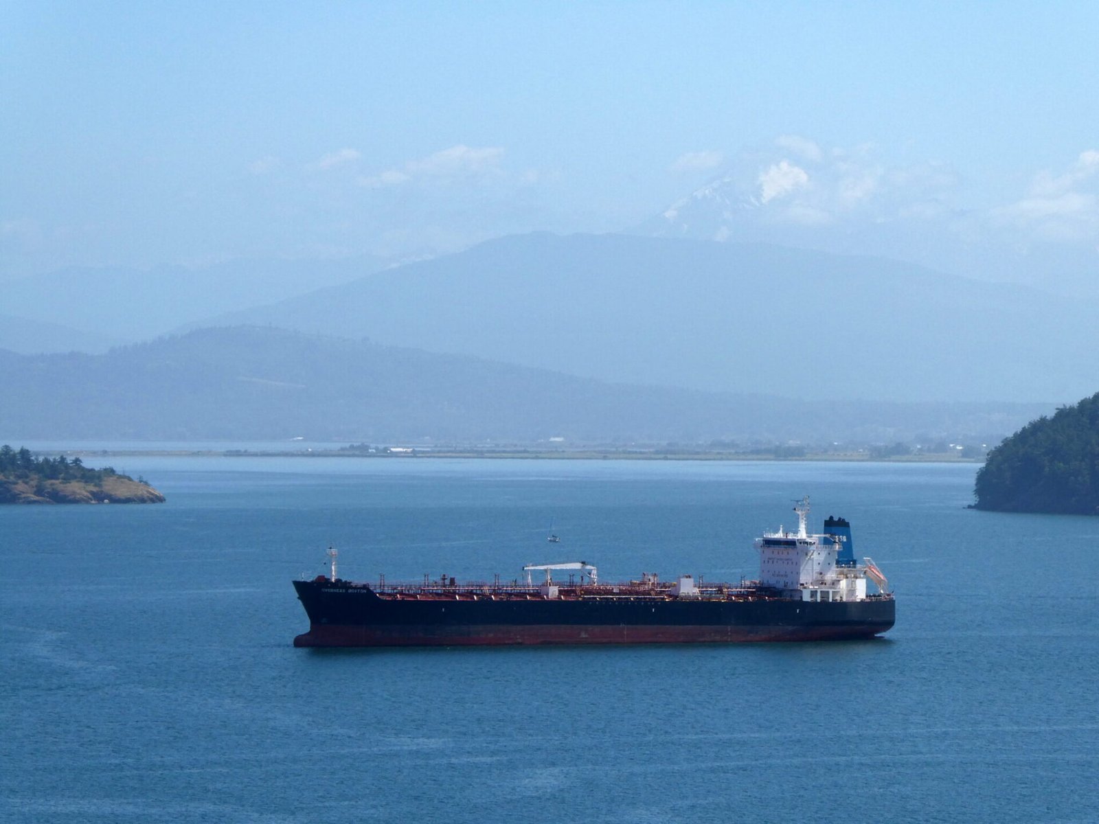 Medium-sized tankers, like this one anchored near Anacortes, could be joined in the Salish Sea by much larger crude oil supertankers if Alberta, Canada succeeds in building a new pipeline and export terminal to the southern British Columbia coast. (Photo by Tom Banse)