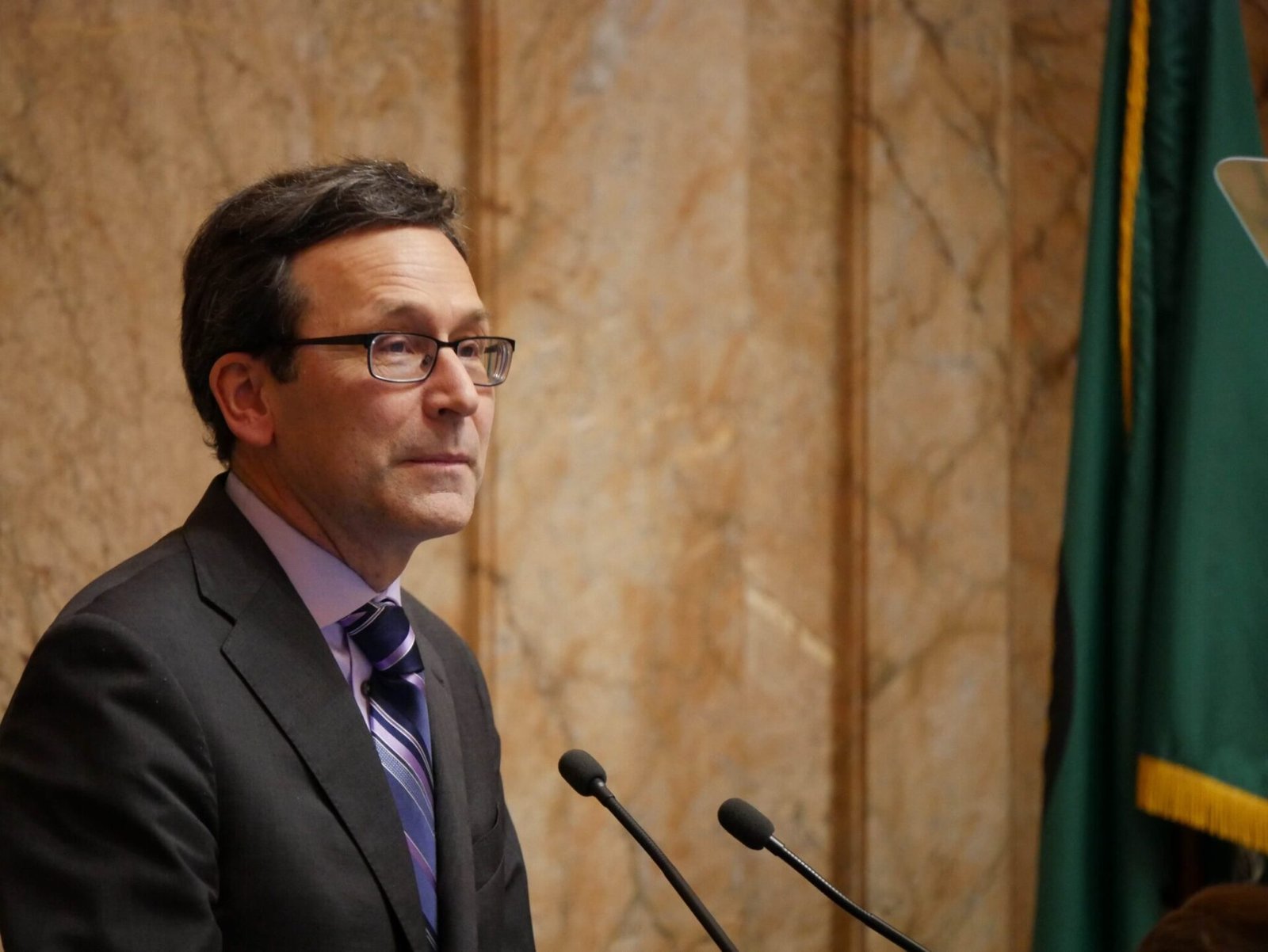 Washington Gov. Bob Ferguson at his State of the State address on Jan. 13, 2026. Ferguson did not discuss the budget cuts he’s proposing in his speech but they’ve stoked plenty of testimony in the first days of the 2026 legislative session. (Photo by Bill Lucia/Washington State Standard)